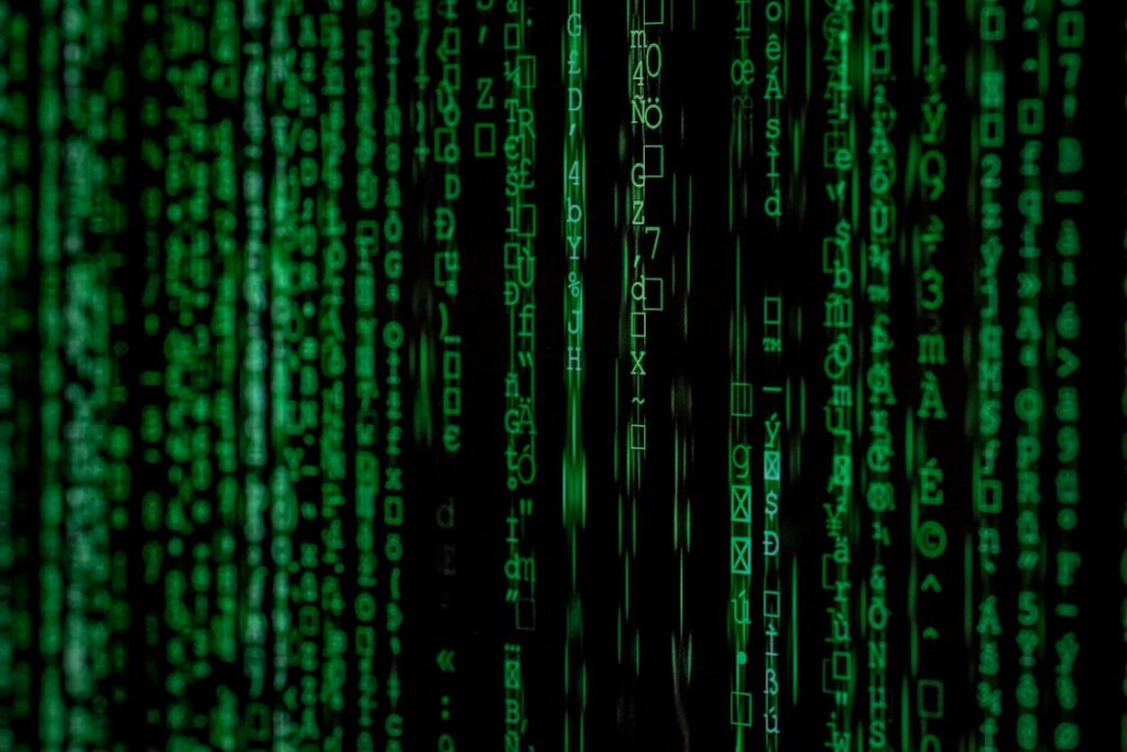 Binary code representing an AI agent attack chain, malicious automation, and cybersecurity threats