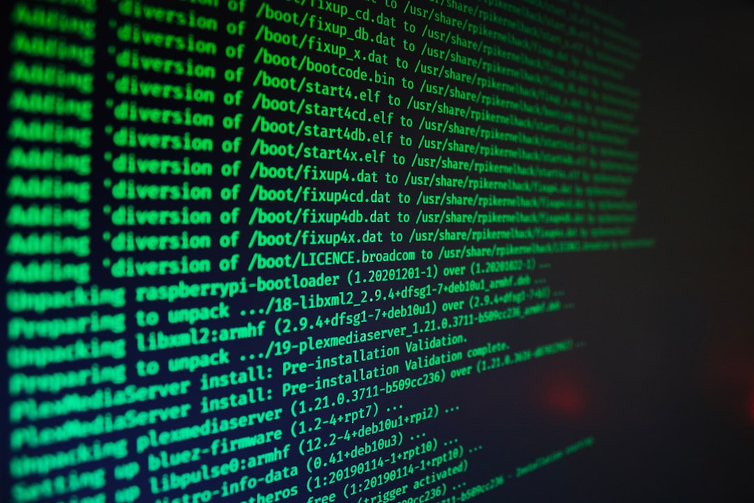 Green computer code on a dark screen illustrating AI-enabled cyber operations and malicious automation
