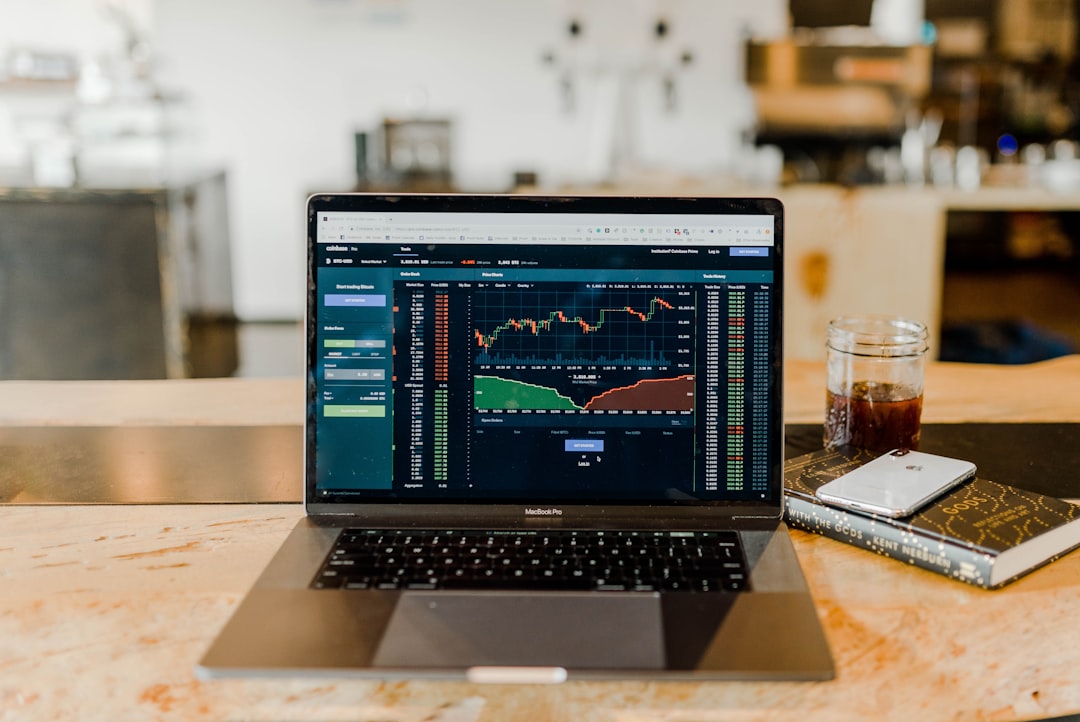 Investor reviewing market charts, illustrating analysis of OpenAI's delayed IPO and AI sector expectations