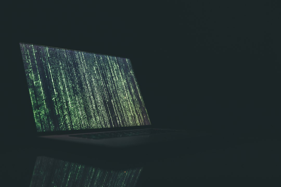 Laptop and security-focused code screens representing AI model safeguards and cybersecurity
