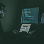 Developer workstation with code on multiple screens illustrating Claude Opus 5.5 coding workflows