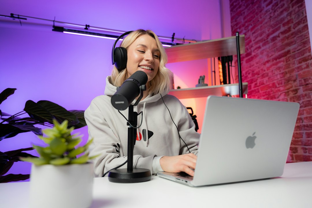 Video creator working with studio microphone and recording equipment