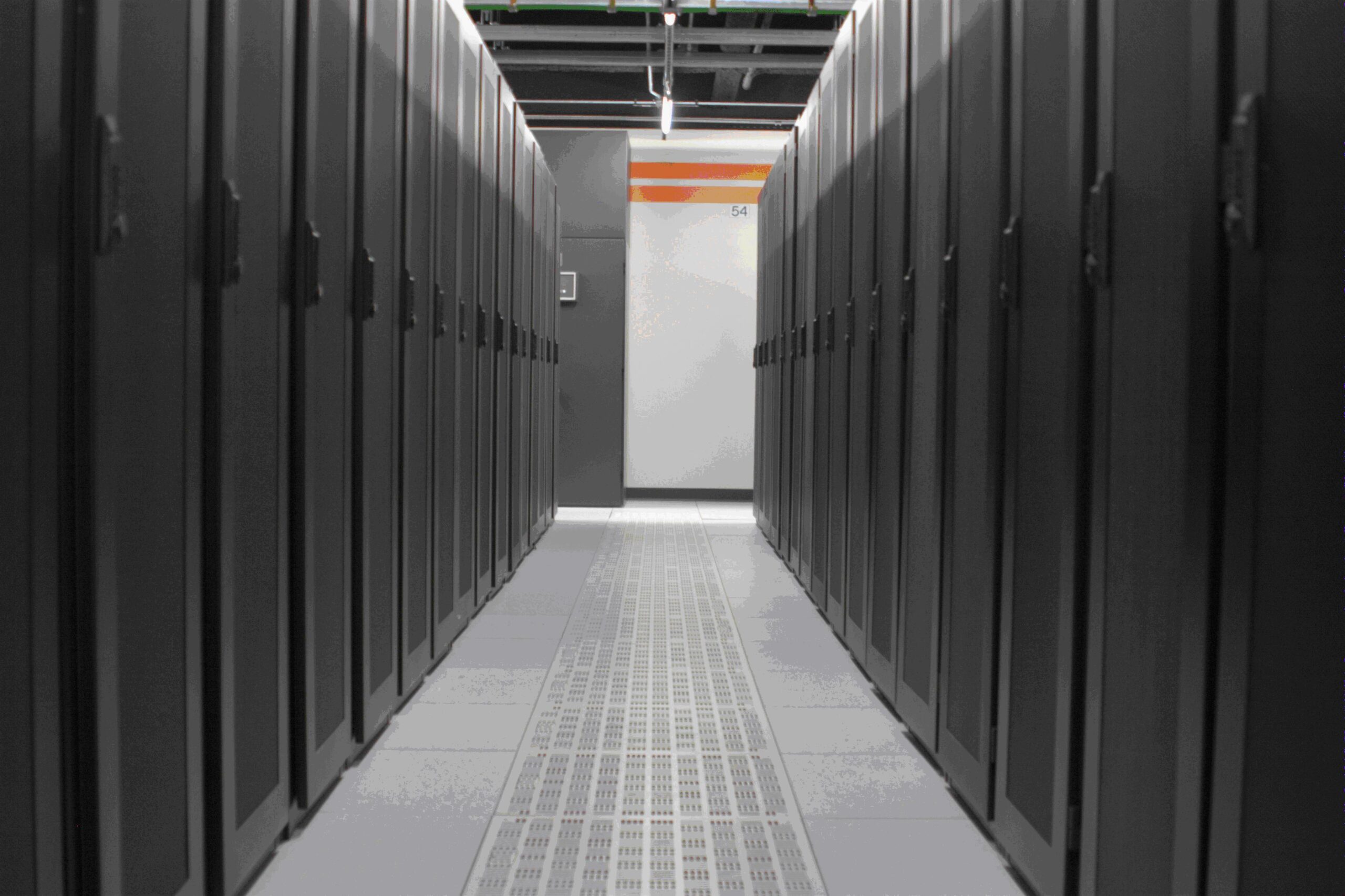 Interior aisle between rows of data center server cabinets