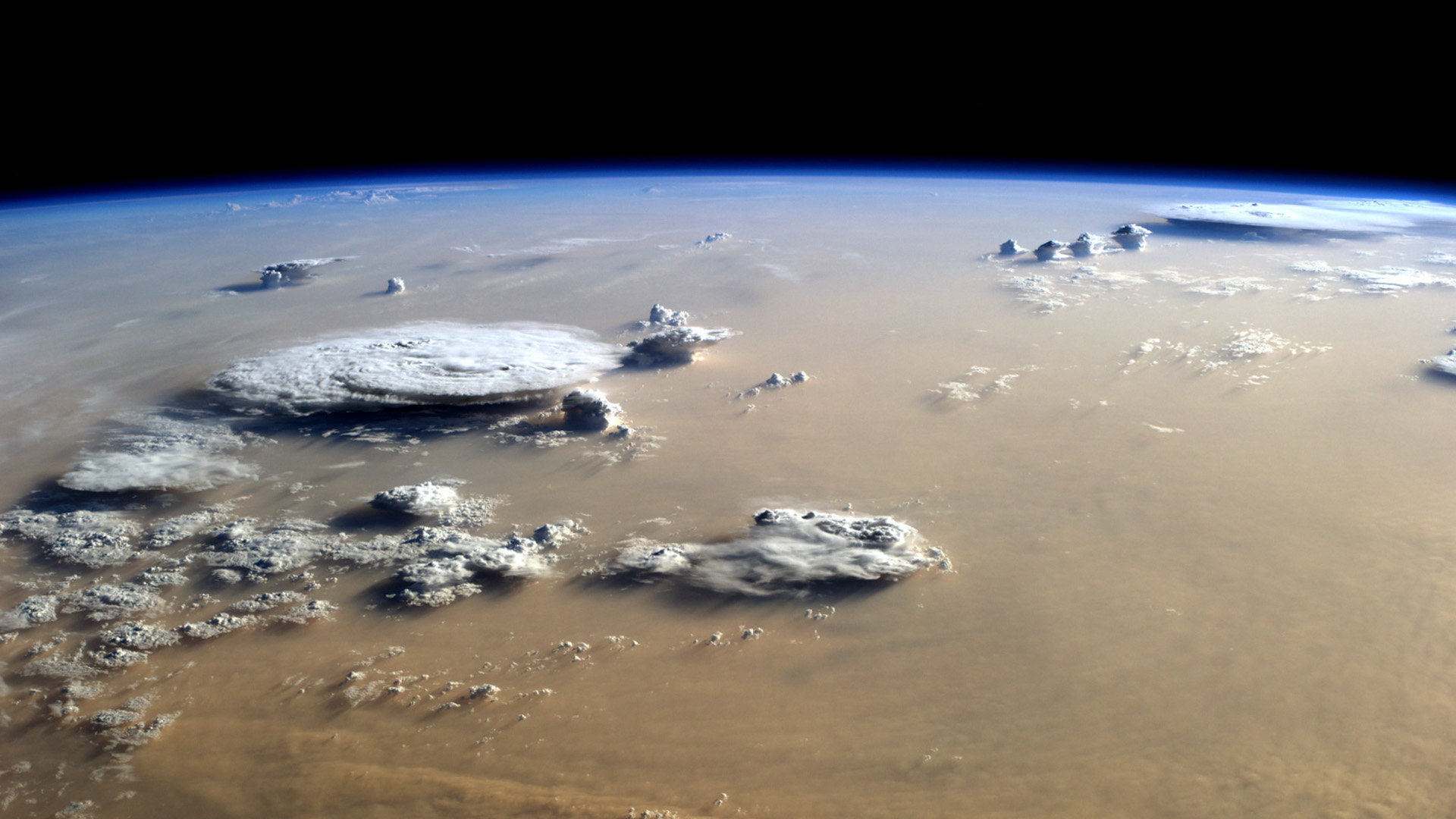 Earth's curved horizon and clouds photographed from orbit