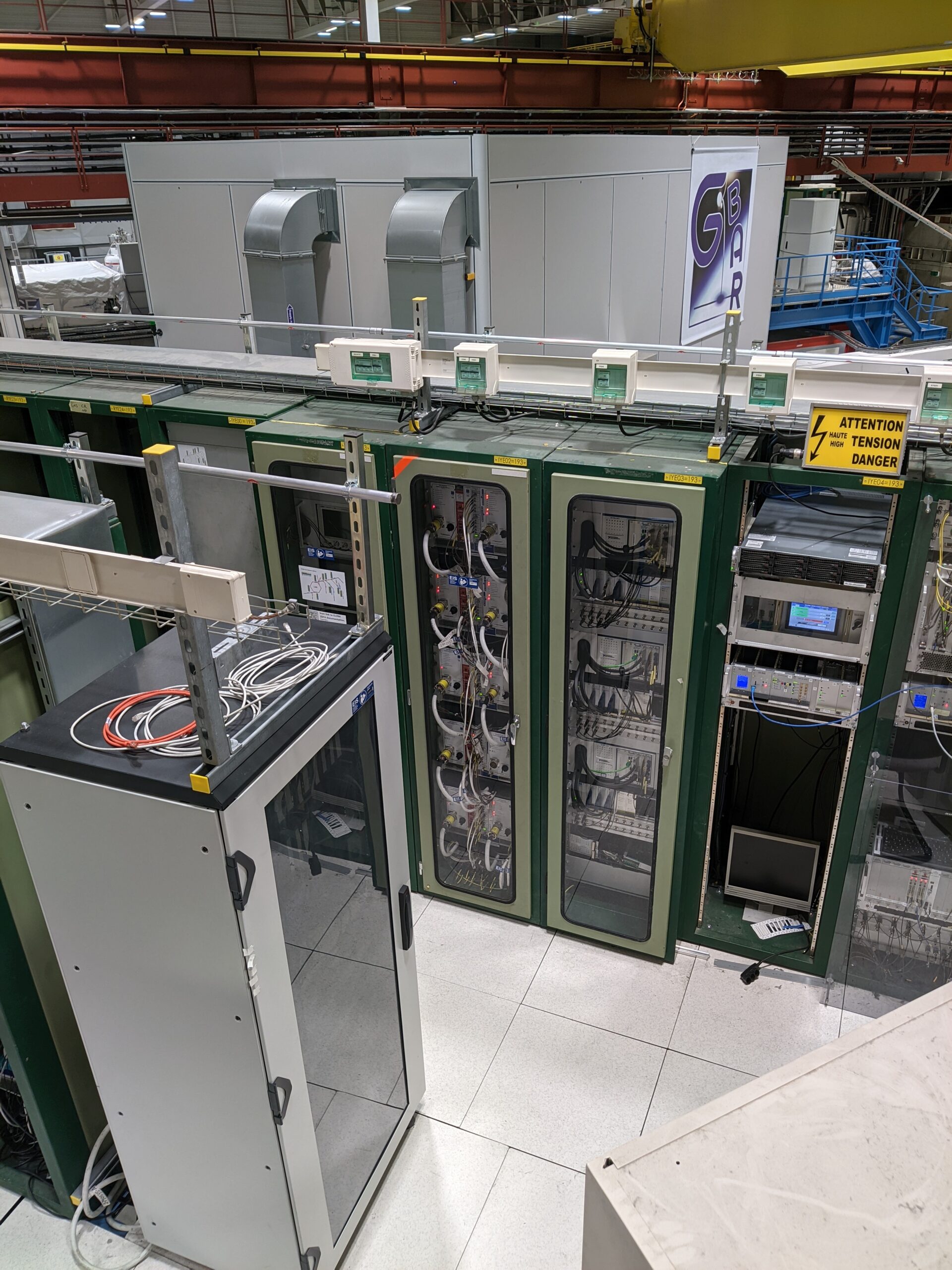 High-density server racks with cabling and cooling equipment