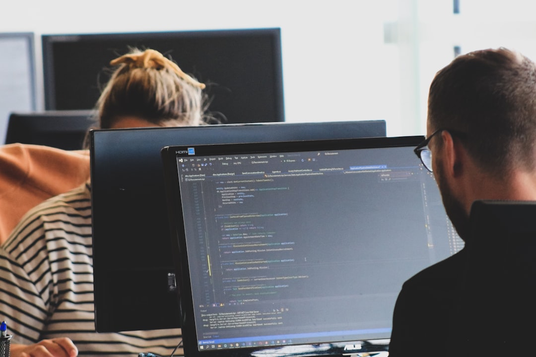 Engineers reviewing code and cloud systems while assessing Kubernetes and GKE security risks