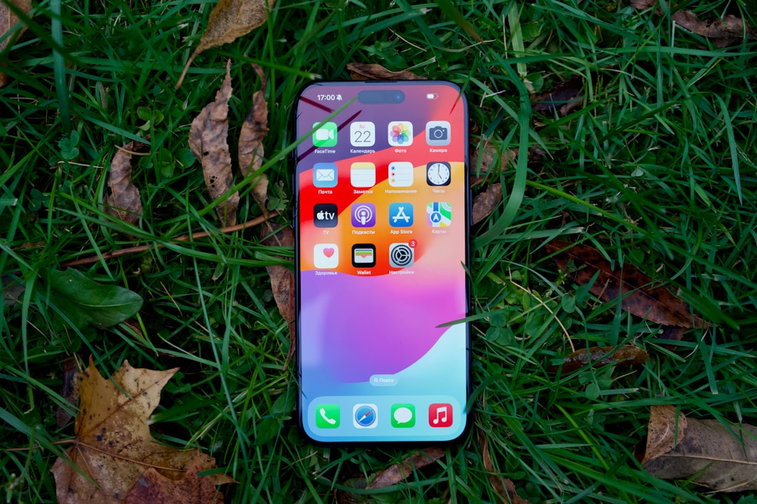 Modern iPhone representing performance, display and charging settings to review after installing iOS 27