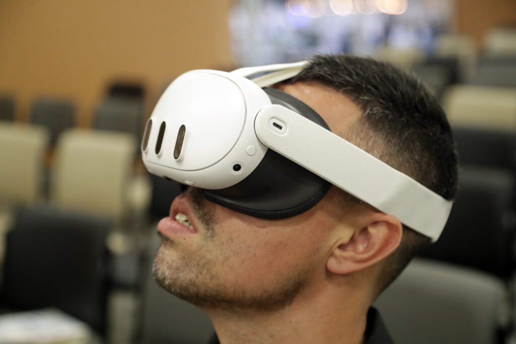 Person wearing a Meta Quest 3 virtual reality headset