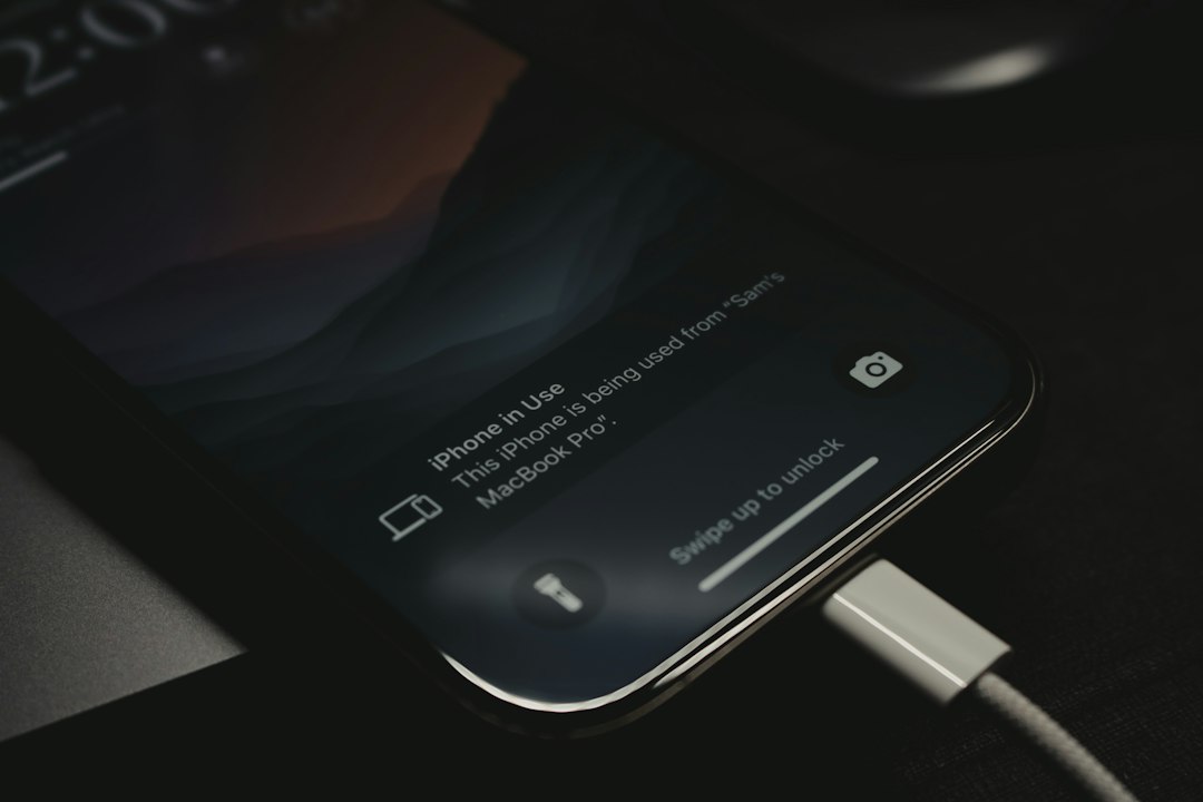 Close-up of a smartphone charging with a cable