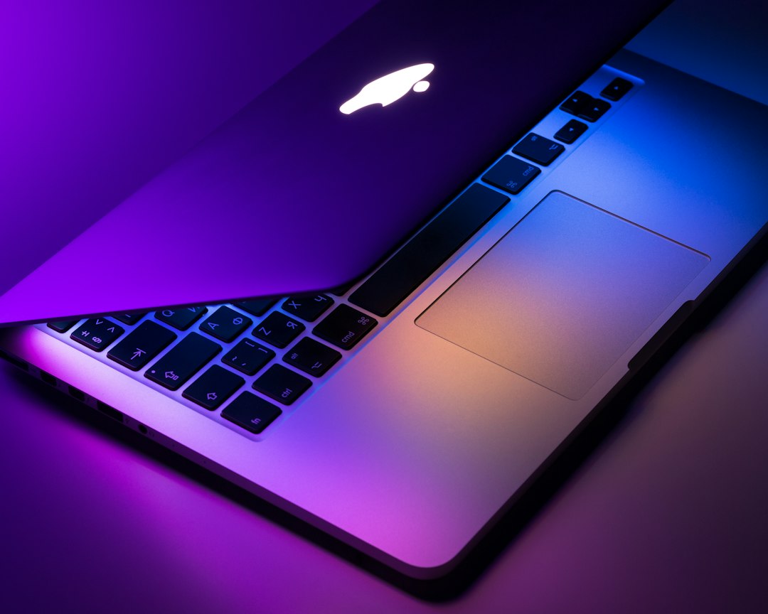 Slim laptop on a desk in a minimal workspace