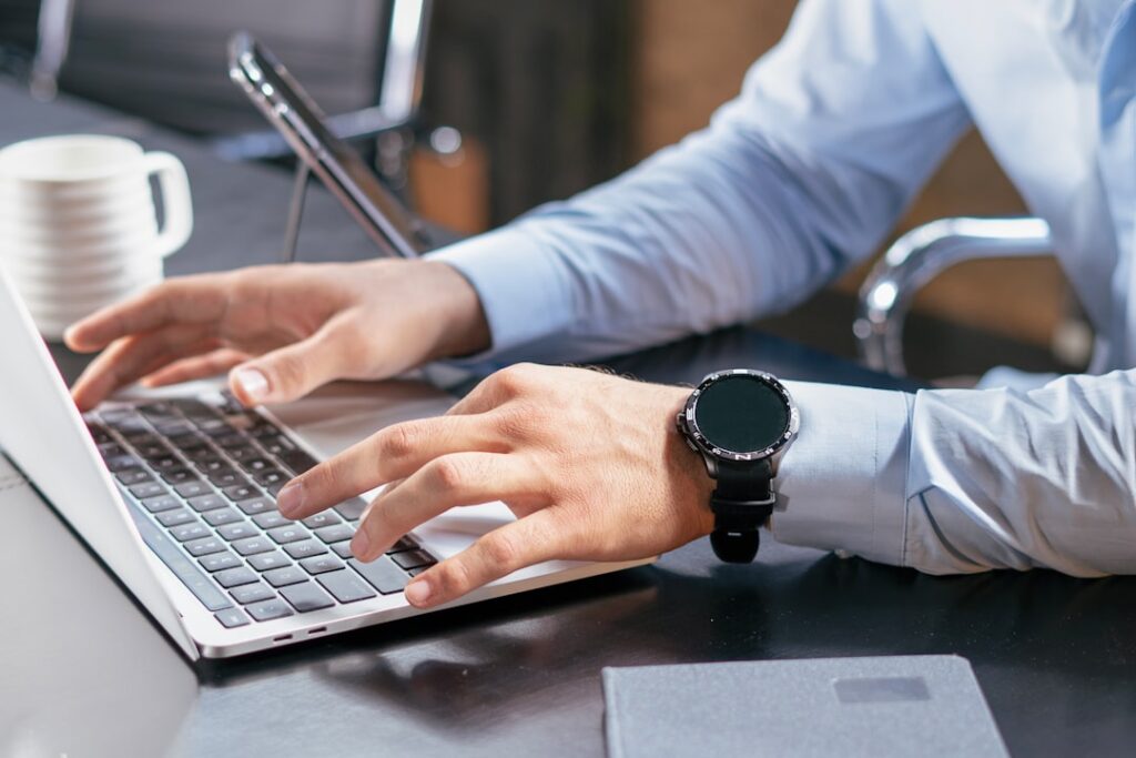 Professional using a laptop for AI-assisted work and research