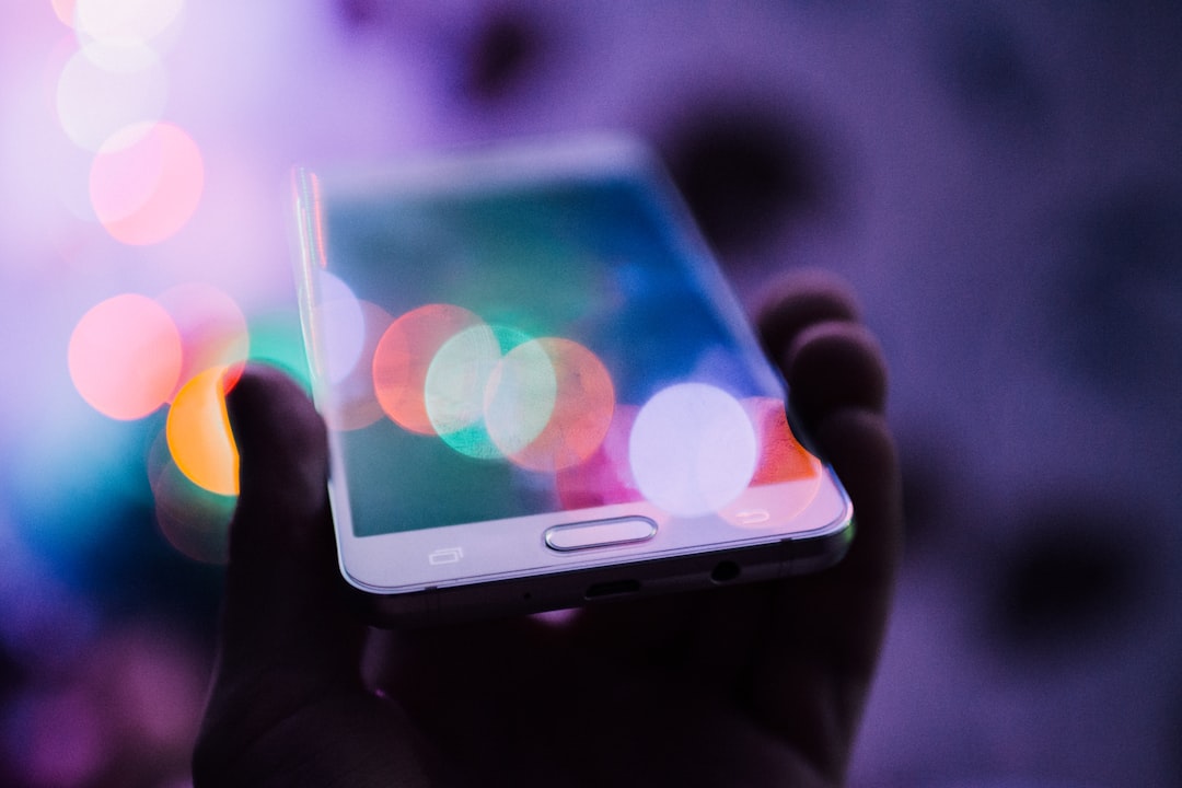 Person using smartphone representing Apple Siri AI personal assistant