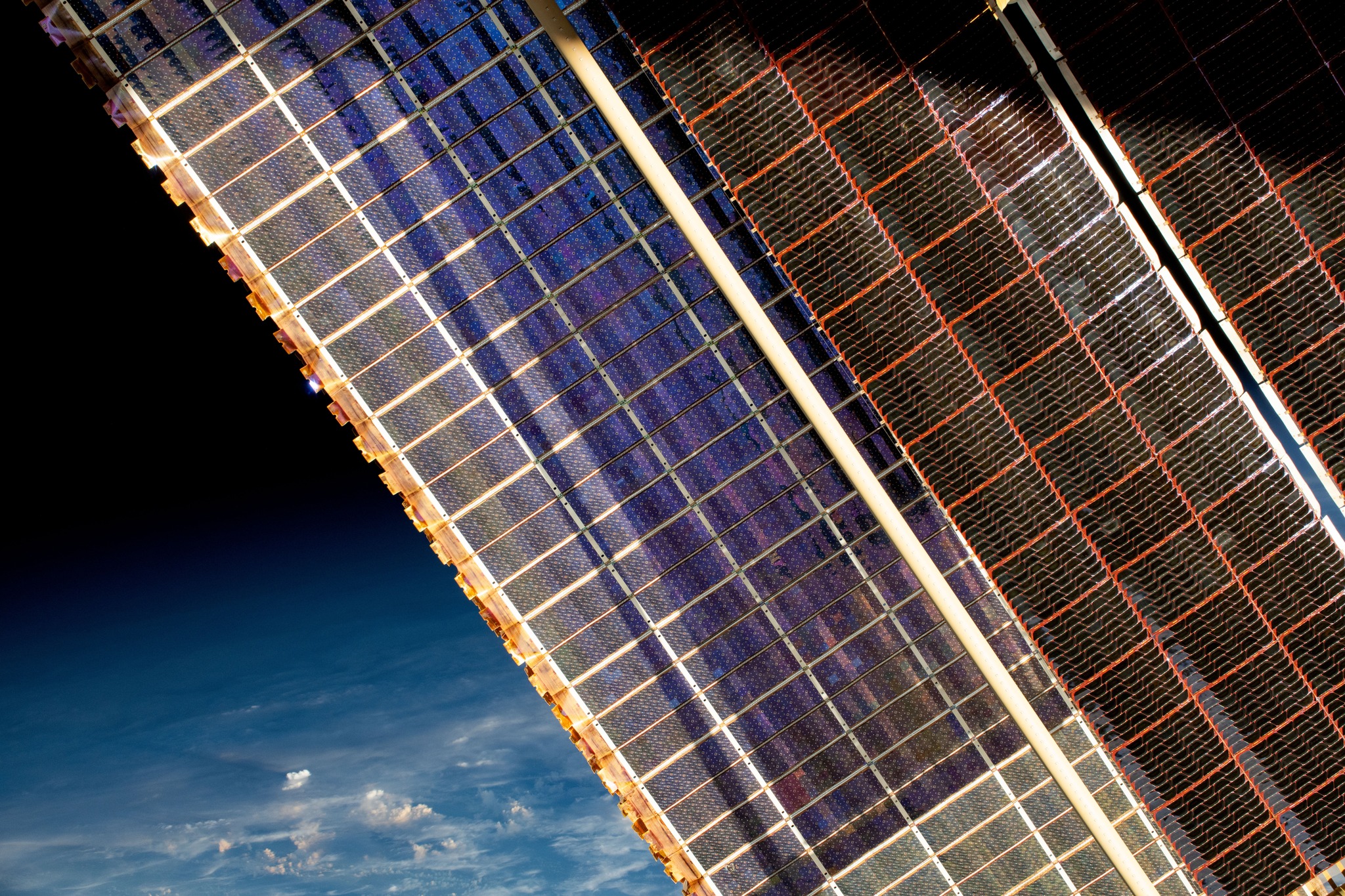 Solar arrays on the International Space Station above Earth