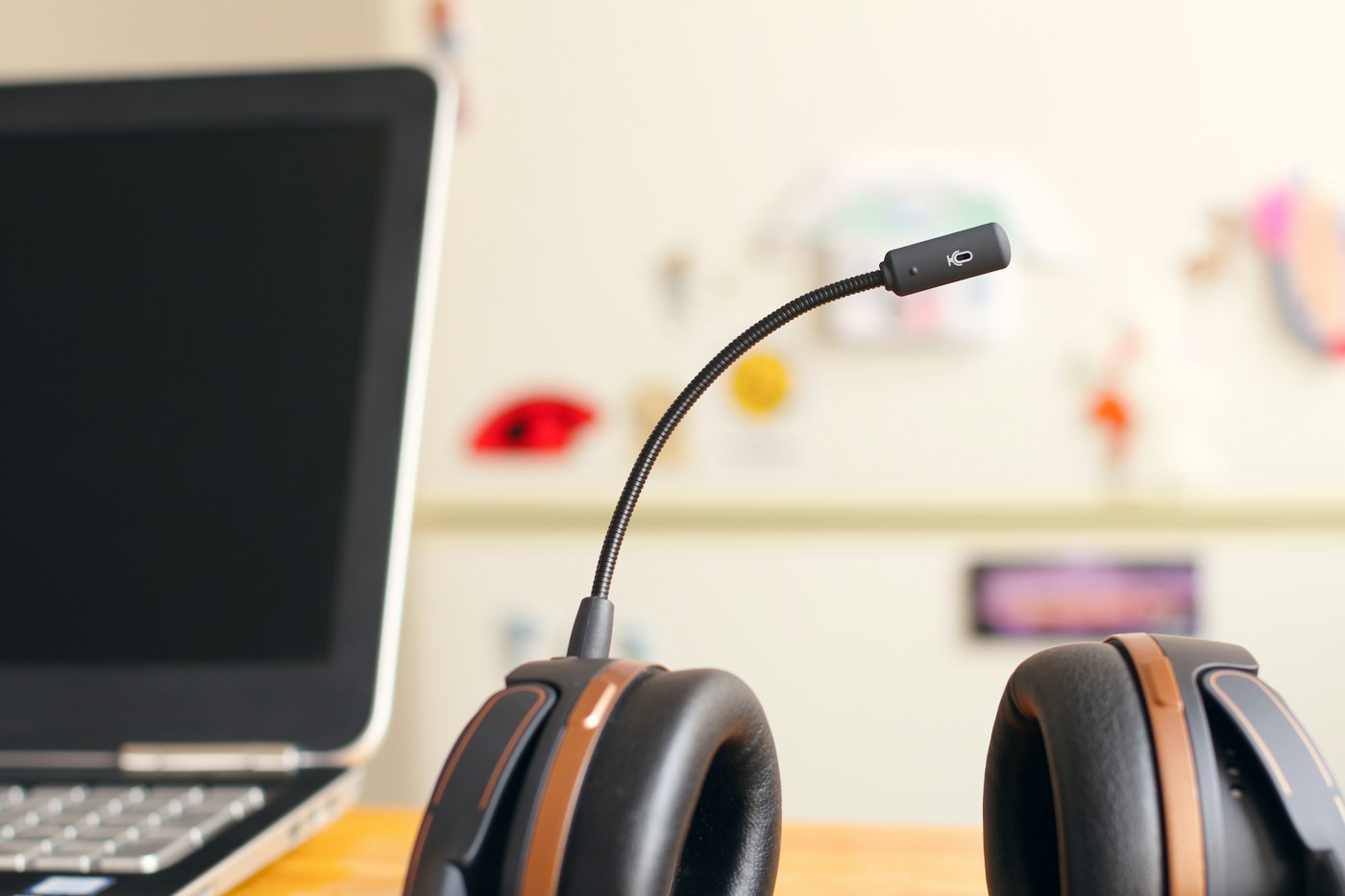 Headset beside a laptop representing development and testing of real-time voice agents