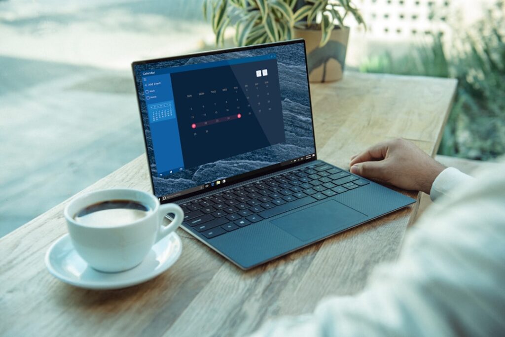 Laptop user verifying a Windows 11 update after installing KB5129195