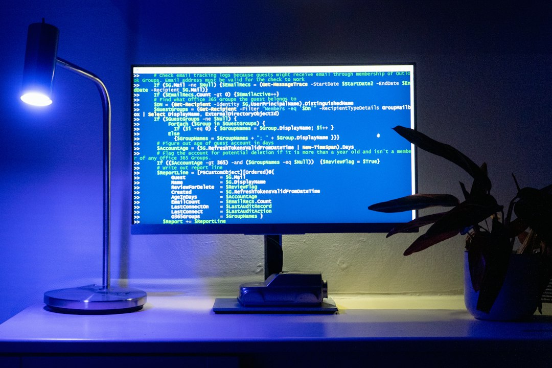Computer screen with code representing Windows patch deployment, vulnerability monitoring and cybersecurity operations