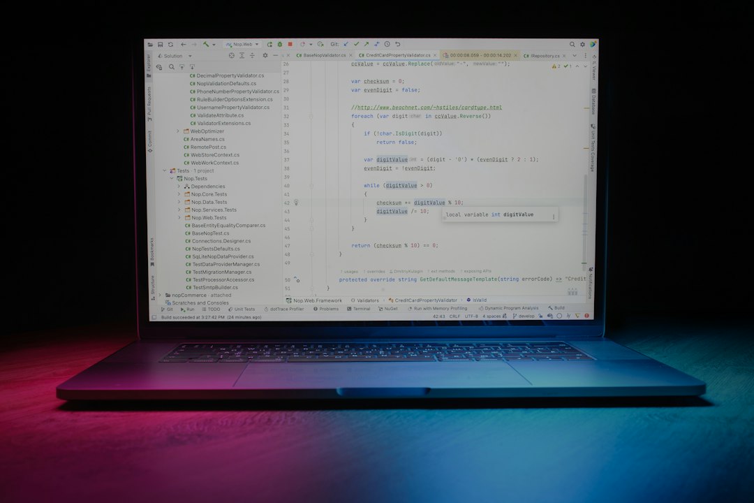 Laptop displaying code representing analysis of actively exploited Windows zero-day vulnerabilities
