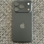 Black iPhone 18 Pro photographed from the back showing its rear camera system