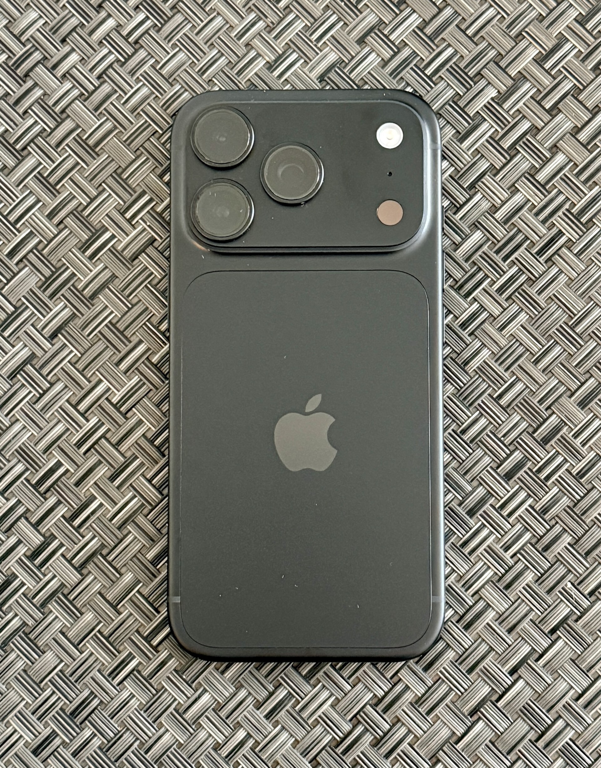 Black iPhone 18 Pro photographed from the back showing its rear camera system